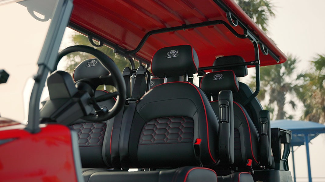 Venom EV street legal golf cart parked in an outdoor lifestyle setting